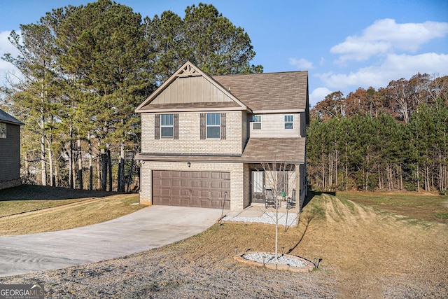 view of front of house with a front lawn and a garage