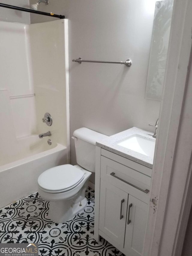 full bathroom featuring tile patterned floors, vanity,  shower combination, and toilet