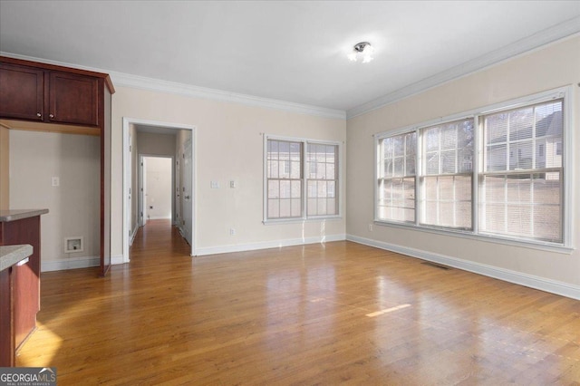 interior space featuring hardwood / wood-style flooring and ornamental molding