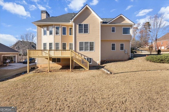 rear view of property featuring a wooden deck