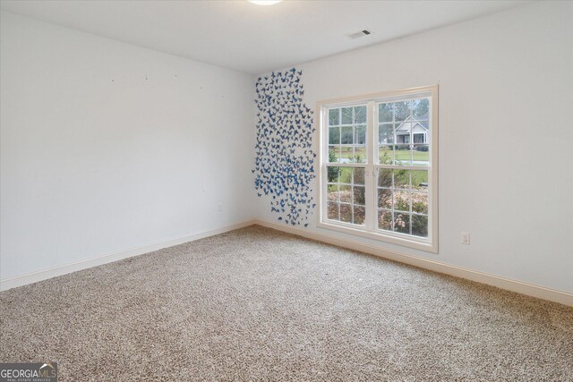 unfurnished room featuring carpet floors