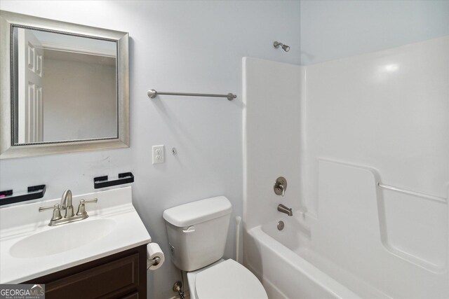 full bathroom featuring vanity, shower / bath combination, and toilet