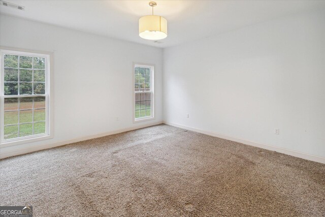 empty room featuring carpet floors