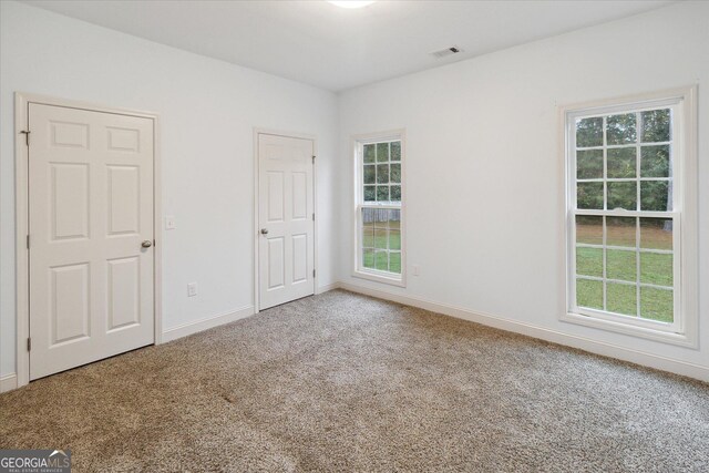 view of carpeted spare room