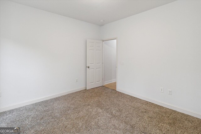 empty room featuring carpet flooring