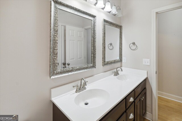 bathroom featuring hardwood / wood-style floors and vanity