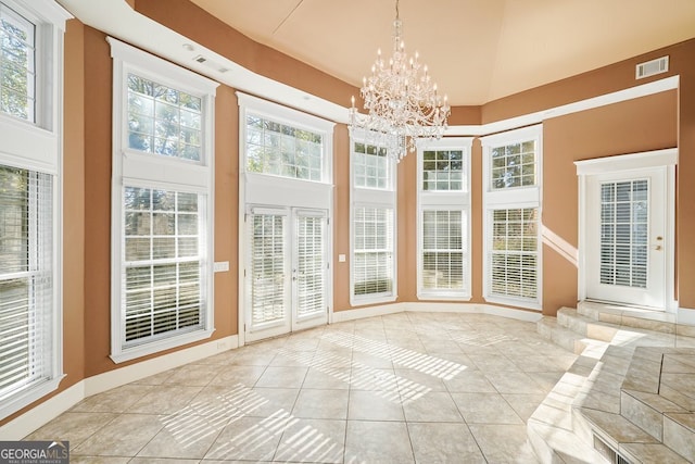 unfurnished sunroom with an inviting chandelier and a wealth of natural light