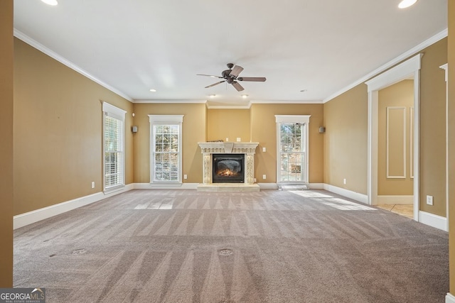 unfurnished living room featuring crown molding and a wealth of natural light