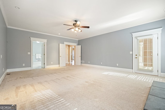 unfurnished room with carpet flooring, crown molding, and ceiling fan