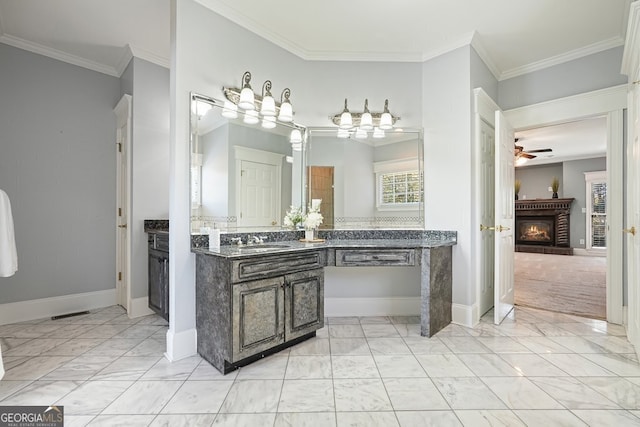 bathroom with vanity, ceiling fan, and ornamental molding