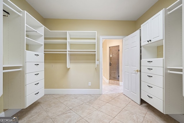 spacious closet with light tile patterned flooring