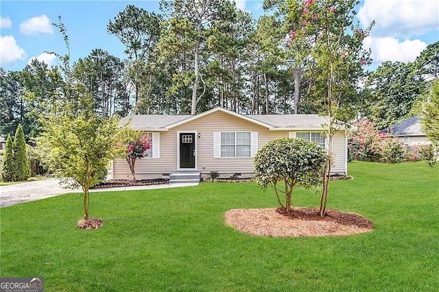 ranch-style home with a front lawn