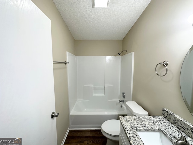 full bathroom featuring shower / bathtub combination, vanity, a textured ceiling, hardwood / wood-style floors, and toilet