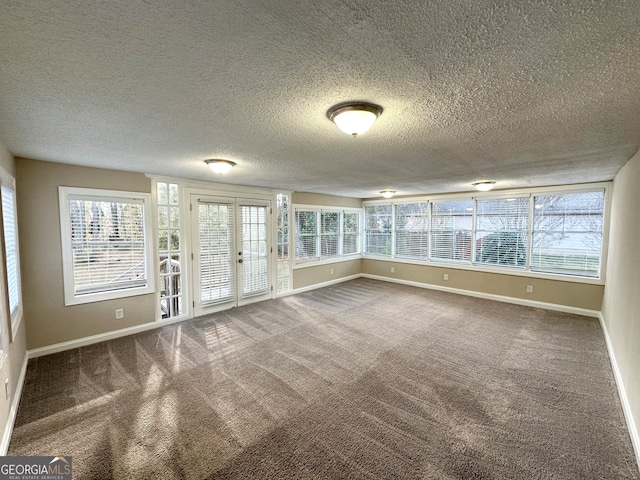 unfurnished sunroom with french doors