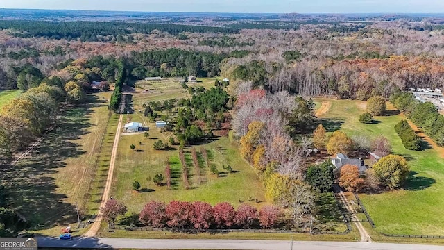 birds eye view of property with a rural view