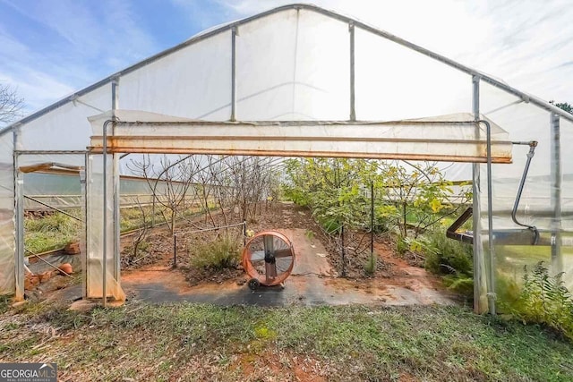 view of patio / terrace with an outbuilding