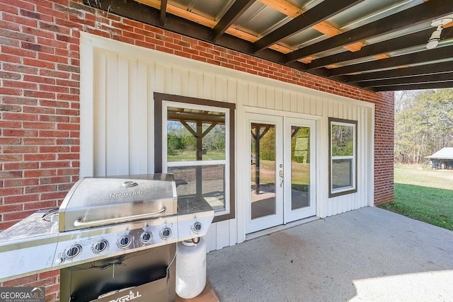 view of patio with area for grilling and french doors