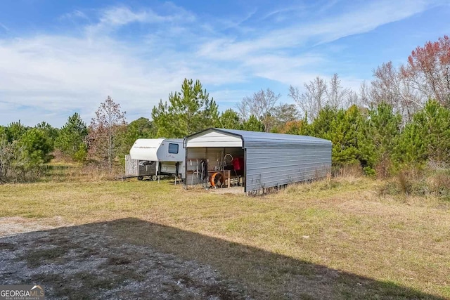 view of outbuilding with a yard