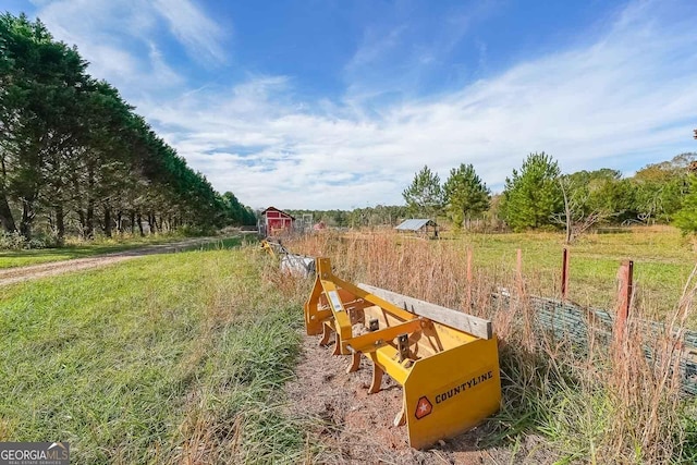 view of yard with a rural view