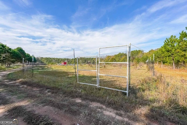 view of gate featuring a rural view