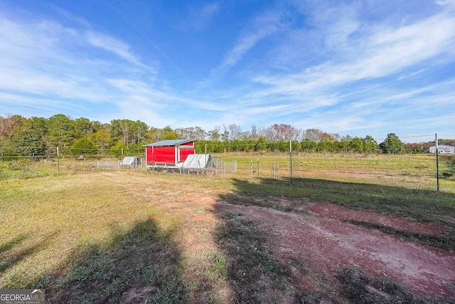 view of yard with a rural view