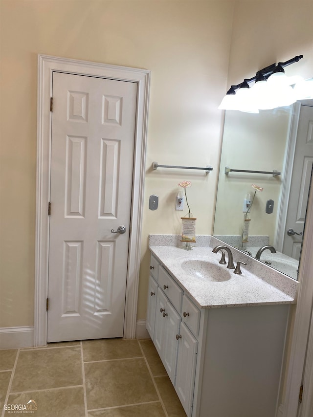 bathroom with tile patterned floors and vanity