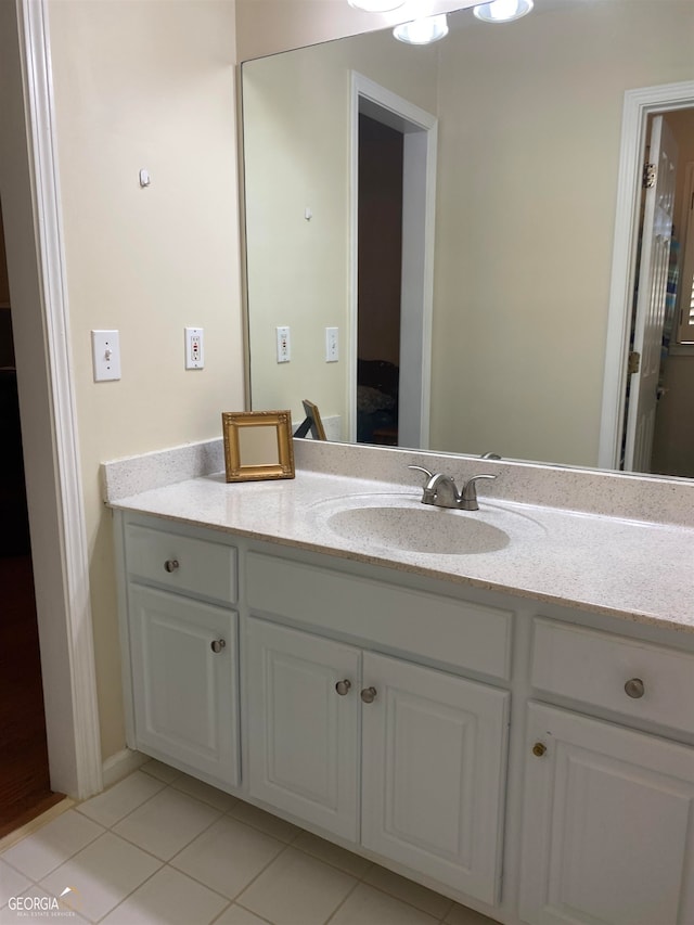 bathroom with tile patterned flooring and vanity