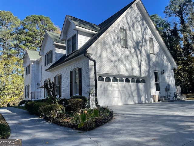 view of side of home featuring a garage