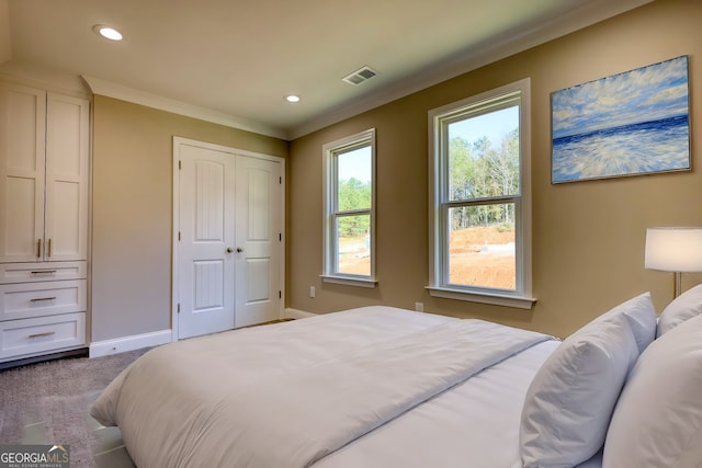 carpeted bedroom featuring ornamental molding, recessed lighting, visible vents, and baseboards