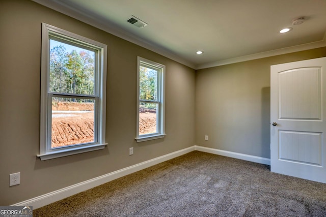 spare room featuring recessed lighting, carpet floors, visible vents, baseboards, and ornamental molding