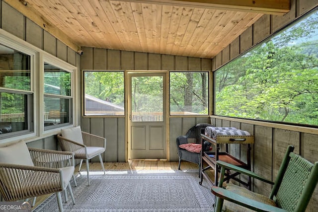 sunroom / solarium with lofted ceiling and wood ceiling