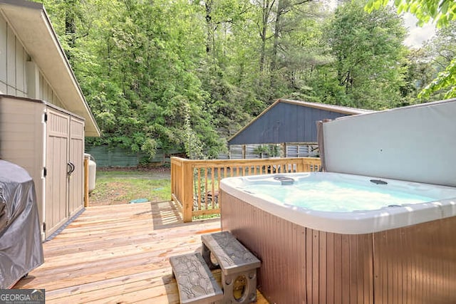 deck featuring a hot tub