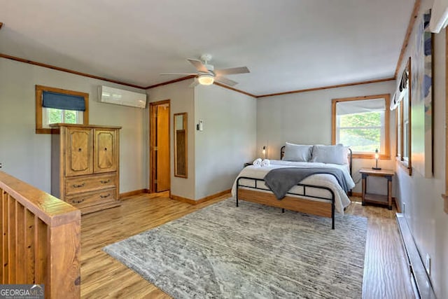 bedroom featuring ceiling fan, a wall mounted air conditioner, a baseboard heating unit, light hardwood / wood-style floors, and ornamental molding