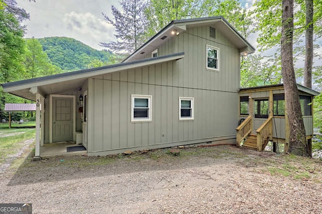 rear view of property with a mountain view