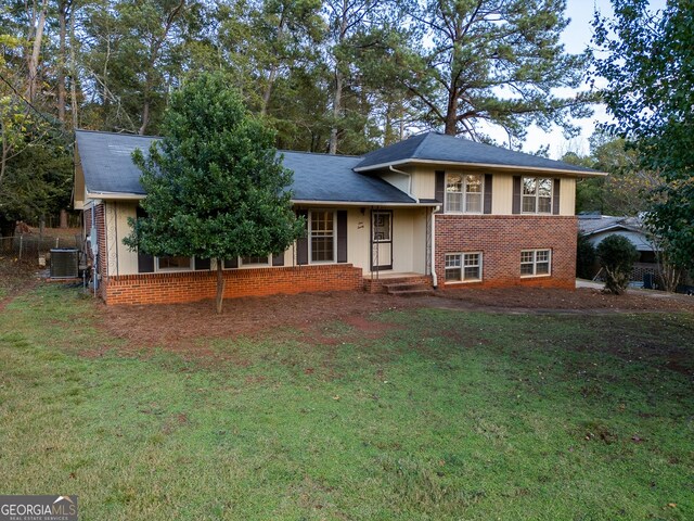 120 Tara Way, Athens, GA 30606 - tri-level home with brick siding, a front yard, and cooling unit