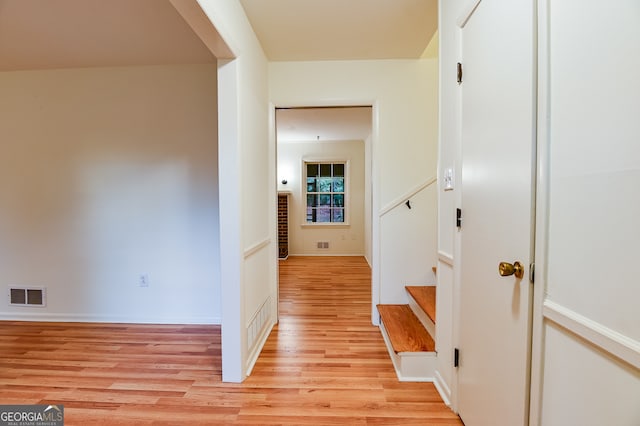 corridor featuring light hardwood / wood-style flooring