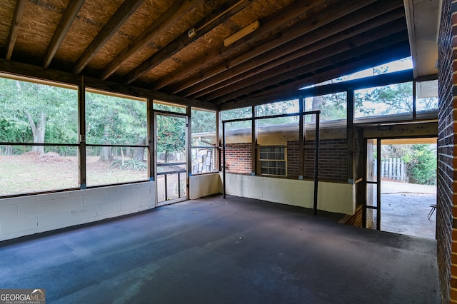 unfurnished sunroom with vaulted ceiling