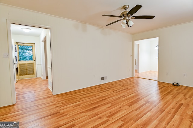 empty room with ceiling fan and light wood-type flooring