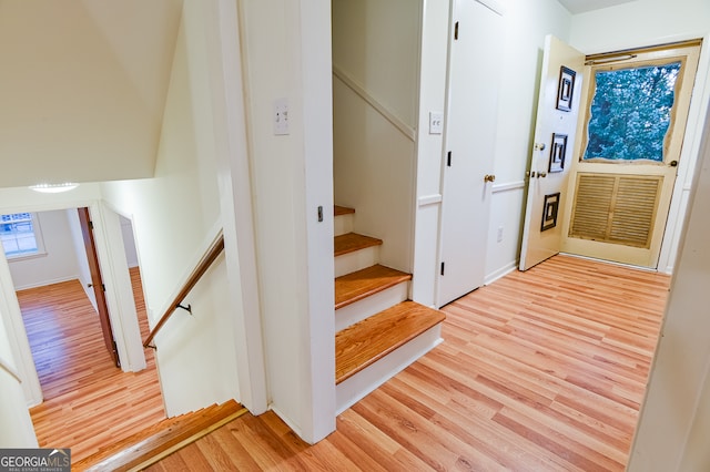 stairway with wood-type flooring