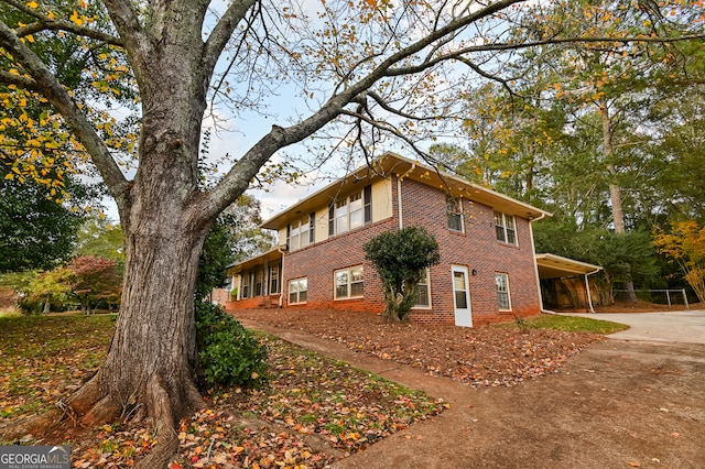 view of home's exterior with a carport