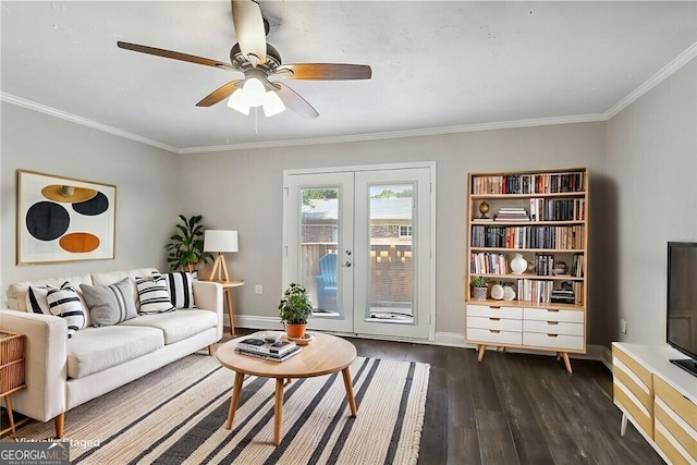 living area with french doors, dark wood-style flooring, crown molding, a ceiling fan, and baseboards