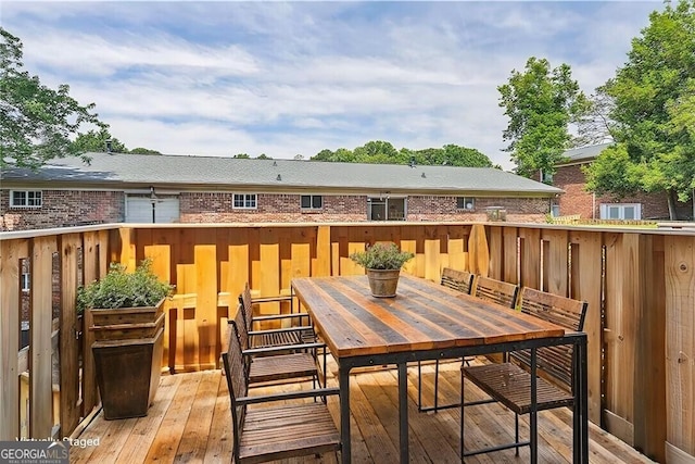 deck with outdoor dining area