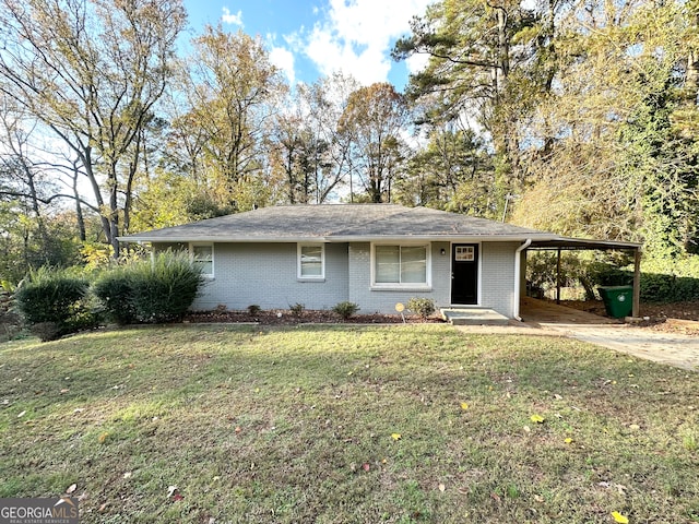 single story home with a front yard and a carport