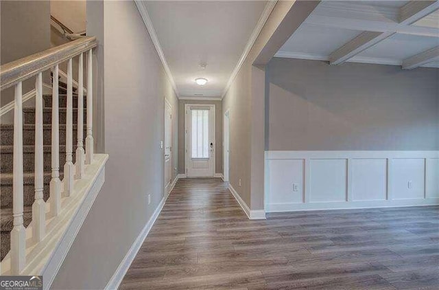 entryway featuring hardwood / wood-style floors, beam ceiling, crown molding, and coffered ceiling