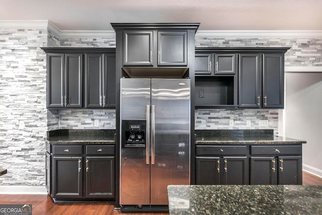 kitchen featuring stainless steel fridge, crown molding, wood-type flooring, and backsplash