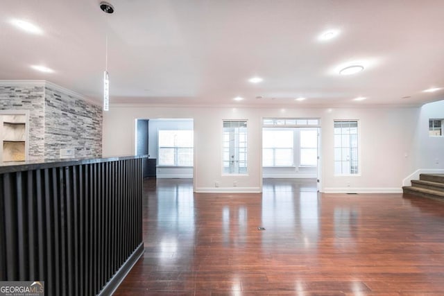 living room with crown molding and dark hardwood / wood-style floors