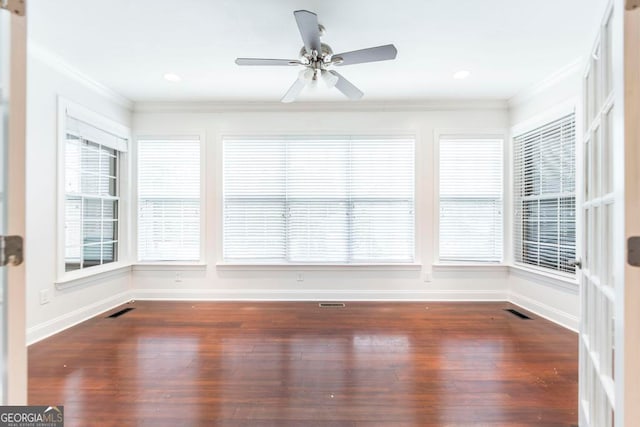 unfurnished sunroom featuring ceiling fan