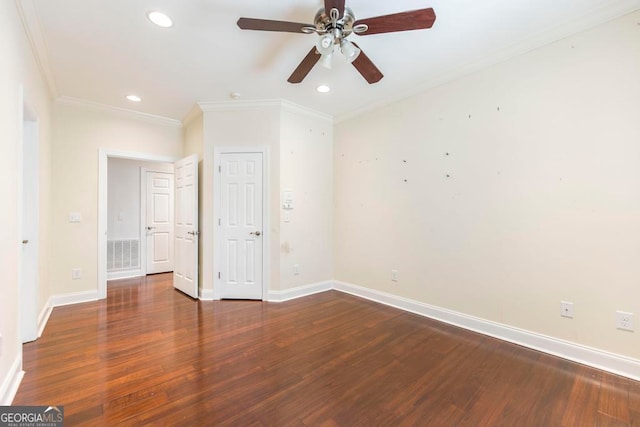 spare room with ceiling fan, dark hardwood / wood-style floors, and ornamental molding