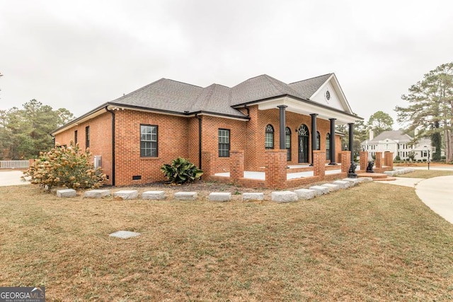 view of side of property featuring a yard and a porch