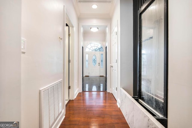 corridor with crown molding and dark hardwood / wood-style floors